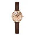 Detail view of the rose gold bezel and champagne dial with slim brown leather strap - Coffee