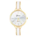 Macro detail of gold quartz watch featuring sparkling rhinestones on a sunray dial - Gold with White