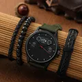 Dettaglio orologio da uomo con cinturino in nylon verde e tre bracciali neri intrecciati - Set Orologio e Bracciale / Verde militare