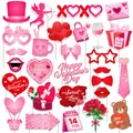 Valentine's Day photo booth props set with pink hearts and cupid cards on white background - Valentine's Day Photo Props Set