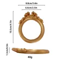 Gouden vintage ovale fotolijst met strikdetail en afmetingen voor sieradenpresentatie - Ovale Lint Strik Stijl