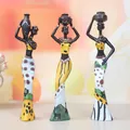 Exotic African tribal women resin figures set of 3 in yellow and green traditional dresses - Yellow Set