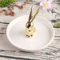 Nordic white ceramic jewelry tray with gold bunny ring holder on wood background - White Tray & Gold Rabbit