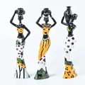 Three-piece set of African tribal resin figurines with colorful tribal patterned dresses - Yellow Ethnic Style (A)