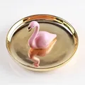 Golden ceramic jewelry tray featuring a pink flamingo statuette for ring storage - Gold Base Flamingo