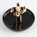 Golden cactus ceramic jewelry tray with a sleek black round base for ring storage - Black Tray Gold Cactus