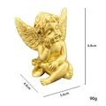 Statuetta di angelo Cupido dorata in resina, seduto con ali e dimensioni, 6,8cm alto - modello A / Oro