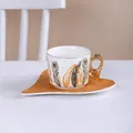 Tasse à café en céramique style européen avec motif plume orange et sa soucoupe - Style Plume B