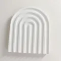 White arched jewelry tray display with artistic concentric grooves for photography - U Shape
