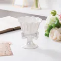 Detail of a pearlescent ceramic bowl with a bow and elegant wavy petal edge design - Without Candle / White