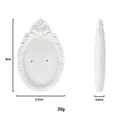 Macro view of white resin jewelry display stand with retro embossed floral pattern - Type C White