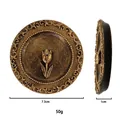 Macro detail of a vintage golden incense tray with relief tulip and scroll patterns - Incense Tray / Style D