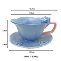 Handcrafted blue ceramic petal coffee cup with pink handle and matching saucer set - Blue