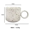 Ceramic 400ml splash ink coffee mug with thick circular handle and off-white finish - White