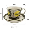 Hand-painted ceramic coffee cup and saucer set with yellow lemon and green leaf pattern - Fruit Green
