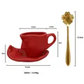 Red matte ceramic face relief coffee cup set with wavy saucer and golden cherry spoon - Red