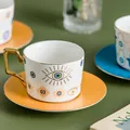 Tazza da caffè in ceramica blu con motivo occhio e manico geometrico placcato oro - Malocchio Linee Dorate Bianco