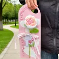 Handmade crochet flower bouquet with pink carnations on a decorative pink paper gift holder - Rose Card