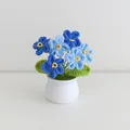 Handmade crochet forget-me-not potted plant with blue yarn flowers and white ceramic pot - Gradient Blue