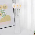 Three white crochet calla lilies in a geometric ceramic vase for home decoration - White