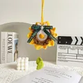 Porte-clés tournesol crocheté main avec pétales jaunes et un nœud en ruban vert - Style Anneau Clochette