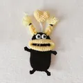 Handmade black knitted monster keychain with funny yellow sausage lips and heart horn - Black with Yellow Braids