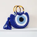 Handmade woven cotton wrist bag with Evil Eye design and amber resin round handles - Blue
