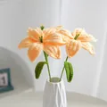 Handmade crochet lily bouquet in apricot yellow with green leaves in a white vase - Yellow