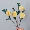 Handmade crocheted yellow rose bouquet with four stems and delicate green leaves - Yellow