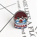 Colorful enamel pin featuring a snow globe with a red cabin and festive Christmas tree - Colorful Winter Snow Globe Style (XZ0657)