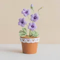 Handmade crochet potted freesia plant with purple flowers and white lace trim - Purple