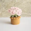 Detail showing hand-crocheted pink daisy petals and intricate knit texture in a pot - Multi-headed Daisy Light Pink