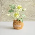 Detail of handmade crochet potted yellow roses with clear knit texture and handmade leather tag - Double Headed Rose Mustard Green