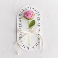 Detail of hand-crocheted pink rose with green stem and Love Is Eternal gold ribbon - New Rose Crochet Flower (Pink Handbag) / Pink