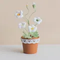Handmade crochet white freesia flower in a clay-colored pot with delicate lace decor - White