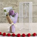 Detail of handmade knitted tulip bouquet inside a transparent portable gift box with ribbon - Deep purple