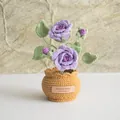 Detailed macro view of handmade crochet purple rose with handmade limited edition tag - Double Headed Rose Purple