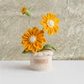 Handmade crochet sunflower potted plant featuring bright yellow flowers and a handmade tag - Orange