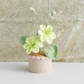 Handmade crochet potted flower ornament with yellow blossoms for home decor - Tung Flower Mustard Green