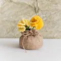 Detailed view of handmade crochet yellow carnations in a rustic burlap flower pot - Double Head Carnation Lucky Bag / Orange