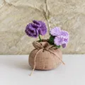 Detail of hand-crocheted purple carnation in a rustic burlap sack pot centerpiece - Double Head Carnation Lucky Bag / Gradient Purple
