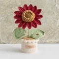Handmade crochet red sunflower potted plant with a ladybug on a knitted leaf - Sunflower-Red