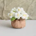Handmade crochet daisy potted plant with white petals and a rustic burlap bag base - White Multi-flower Puff Flower