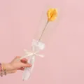 Handmade yellow knitted Calla Lily in gift packaging with ribbon and pink background - Calla Lily Yellow