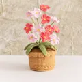 Handmade crocheted potted plant with pink and red flowers in a tan woven base - 12 Head Forget-me-not Pink