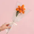 Handmade orange crochet lily flower gift with green leaves and elegant wrapping - Blooming Tulip Orange
