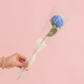 Handmade knitted blue crochet rose flower wrapped in gift paper for Mother's Day - Rose Blue