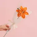 Handmade orange crochet rose in gift wrapping with a LOVE IS ETERNAL ribbon decoration - Lily - Orange