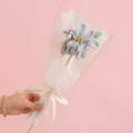 Handmade light blue knitted rose in a transparent Love You gift wrap with cream ribbon - Tung Flower Blue
