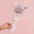 Handmade crochet light purple rose bouquet wrapped in white paper with a bow - Tung Flower Purple